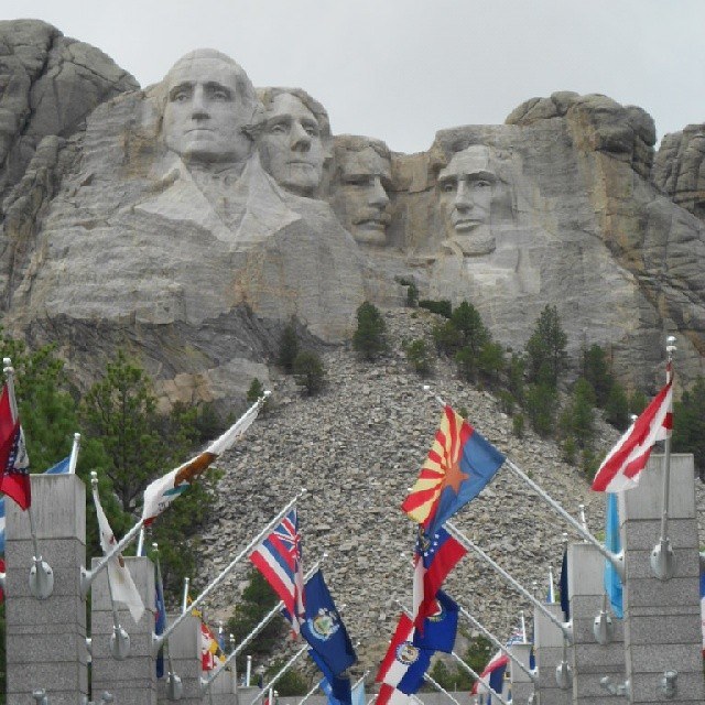 Mount_Rushmore_rises_above_the_Avenue_of_Flags.__SouthDakota__IGTravelThursday__MountRushmore