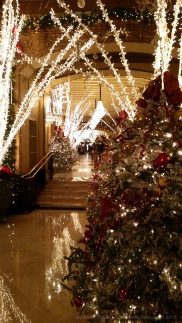 Decorated Christmas trees and lighted boughs at Roosevelt Hotel in New Orleans. New Orleans Christmas travel tips.