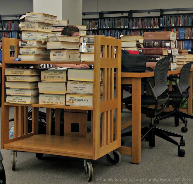 Piles of books hide genealogists at The Genealogy Center in Fort Wayne, Indiana.